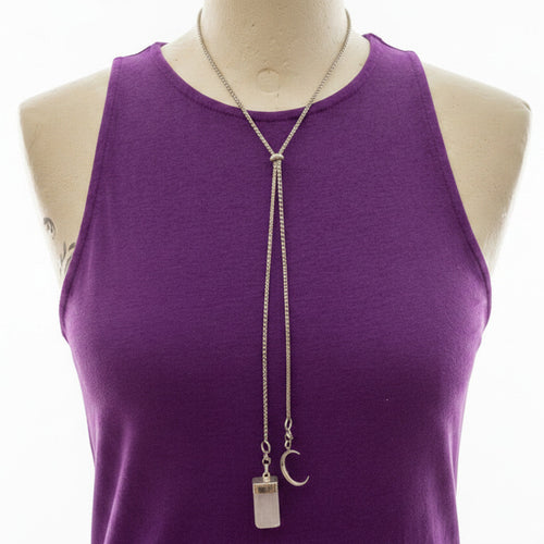 Purple tank top with a long necklace on a mannequin against a white background