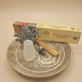 Palo Santo and Copal incense, ganesha statue, pendulum, palo santo stick with  on a wooden surface