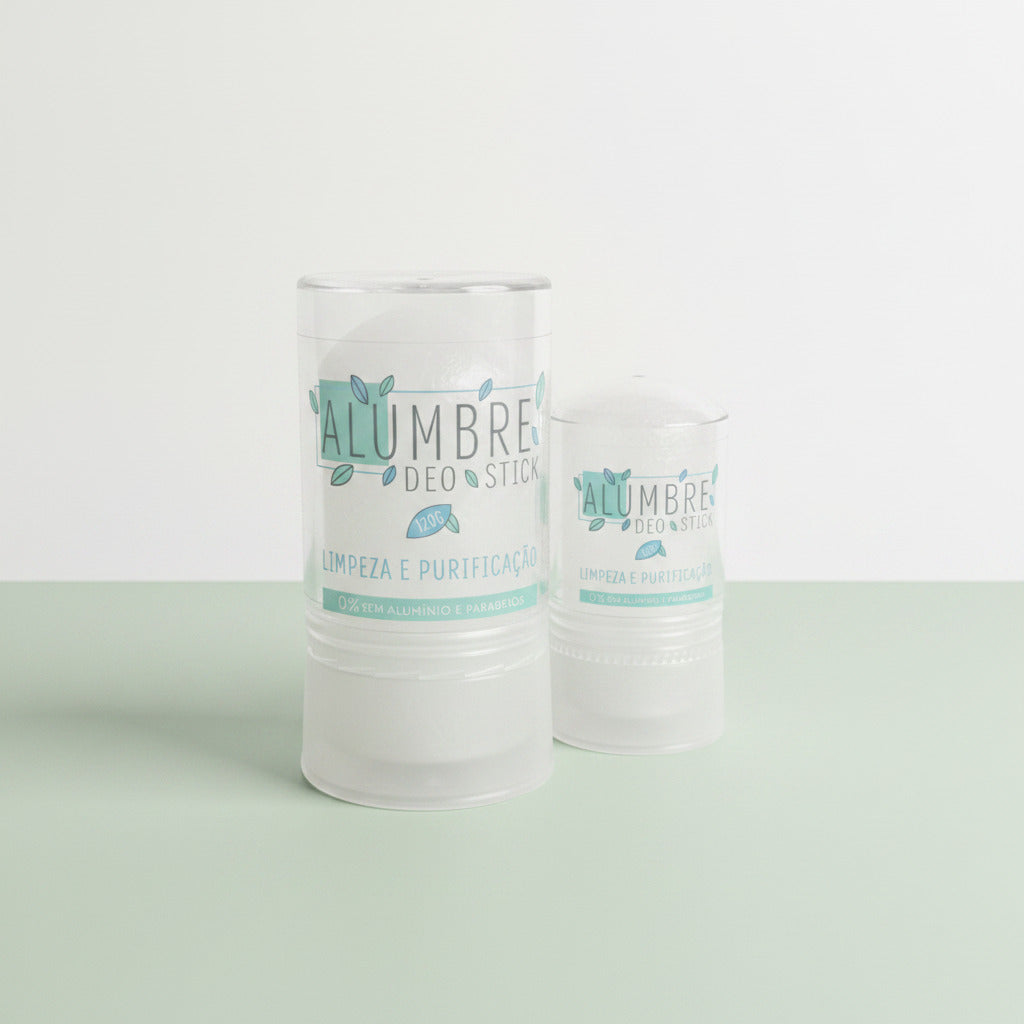 Two Alumbre deo stick on a light green surface with white bacground