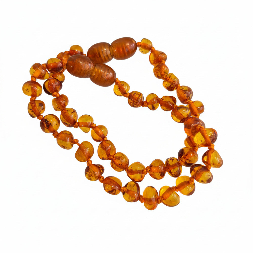 Amber teething bracelet on a white background
