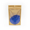 Clear plastic bag with blue powder inside on a white background