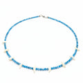 A beaded necklace with small blue faceted beads and alternating white shell-like accents, displayed on a white background.