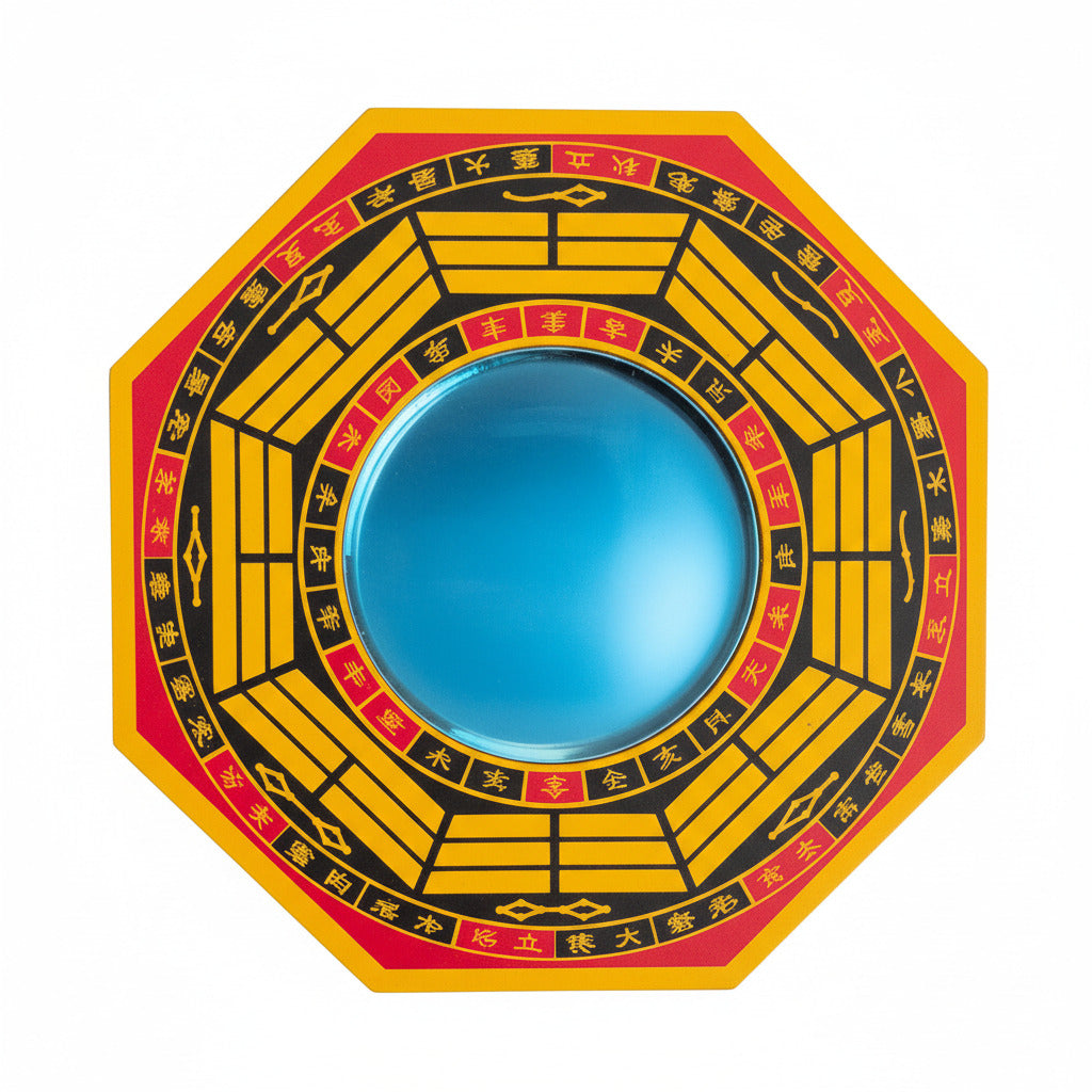 Circular object with yellow and red design, with mirror in center on a white background
