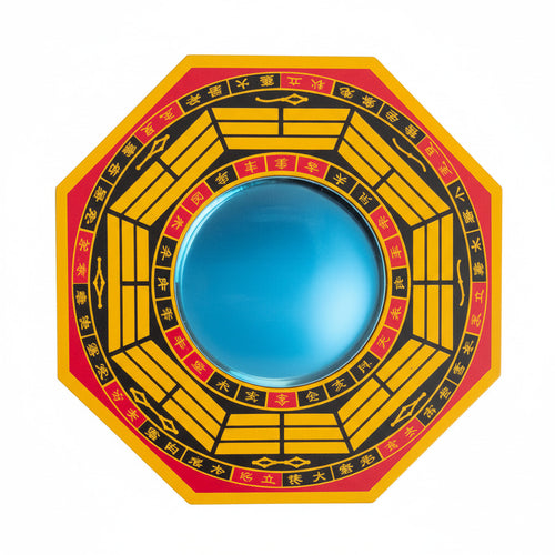 Circular object with yellow and red design, with mirror in center on a white background