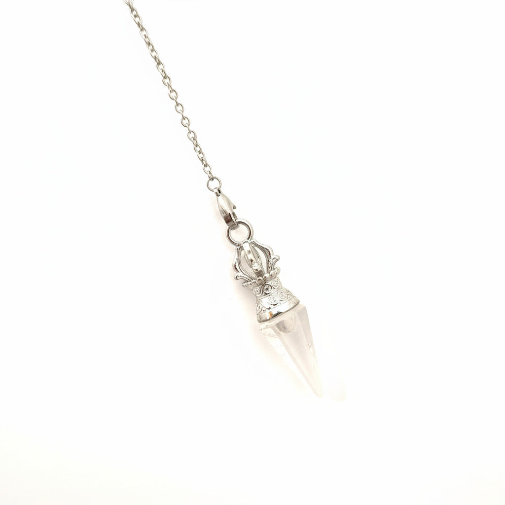clear quartz pendulum on chain in a white background