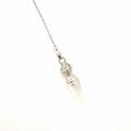 clear quartz pendulum on chain in a white background