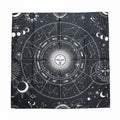 Black and white astrological tapestry with celestial designs on a plain background