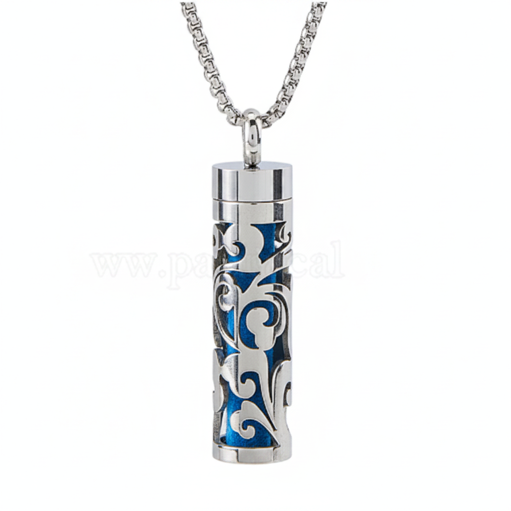 Two silver necklaces with cylindrical blue and white patterned pendants, next to a stack of colorful fabric swatches.