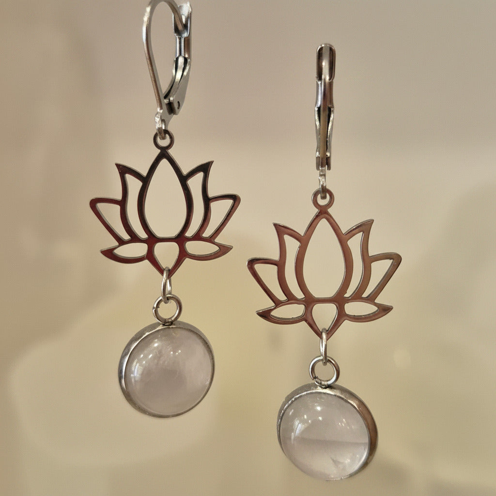 Lotus flower earrings with natural stone pendants on a beige background