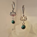 Pair of earrings with floral designs and natural malachite.
