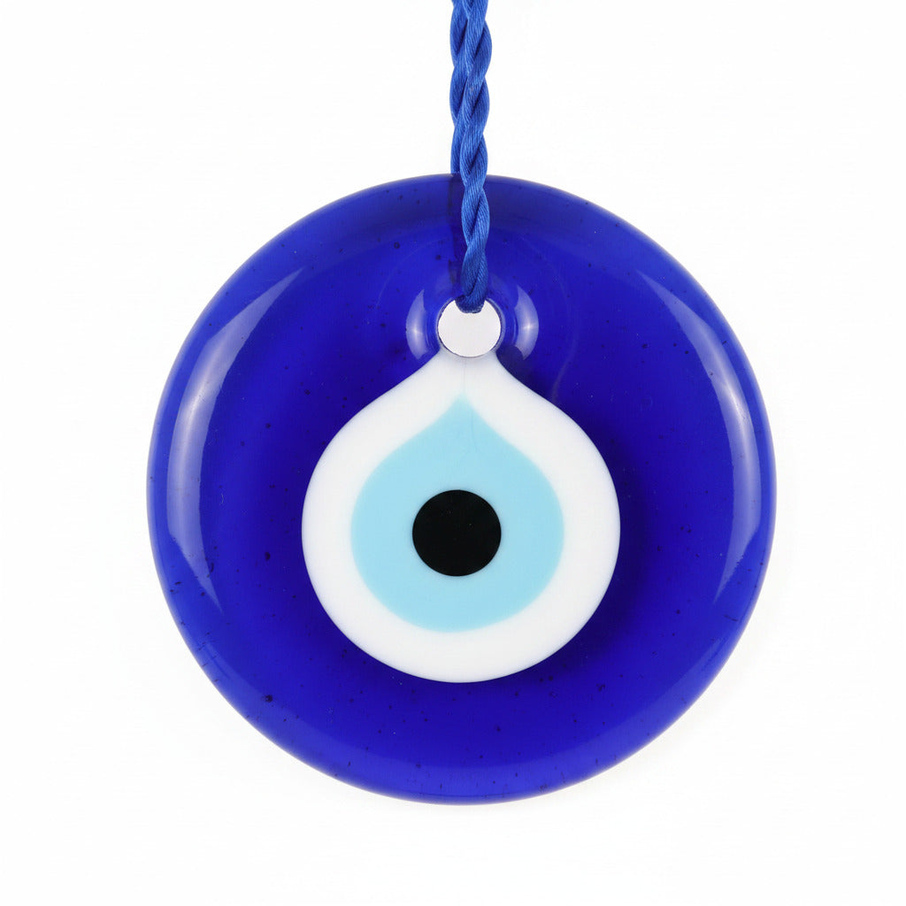 Blue evil eye pendant on a white background