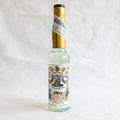 Bottle of Florida Water cologne with decorative label on a white background