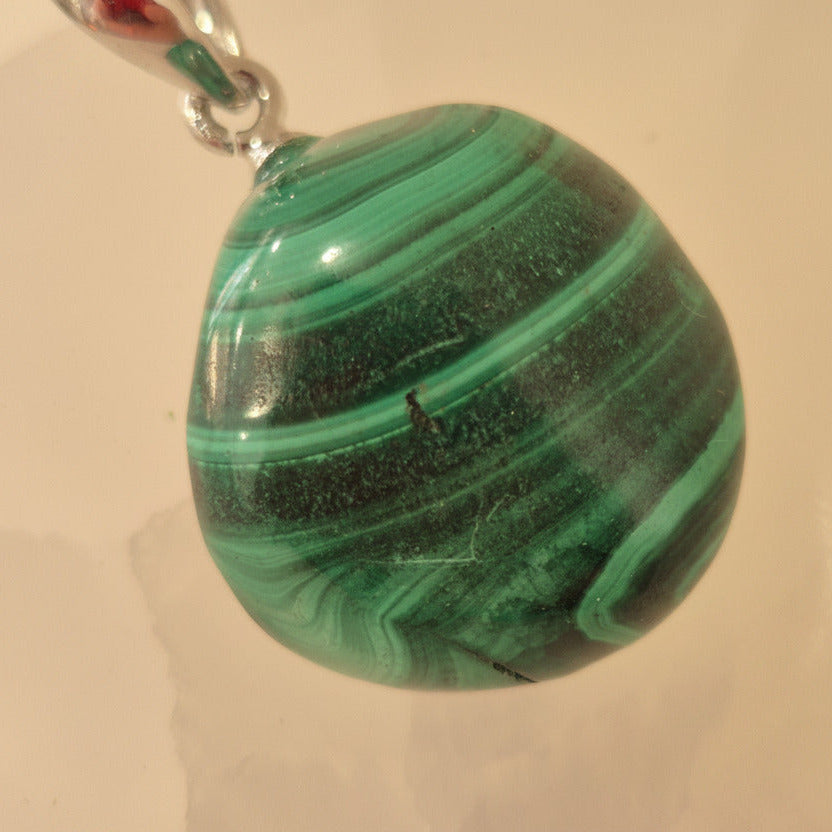 malachite pendant with a  beige background