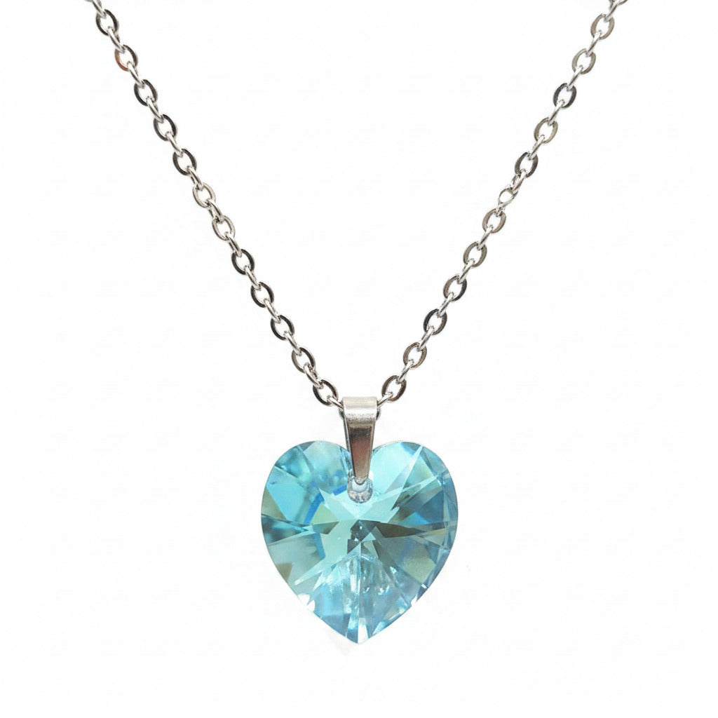 Blue heart-shaped pendant on a chain against a white background
