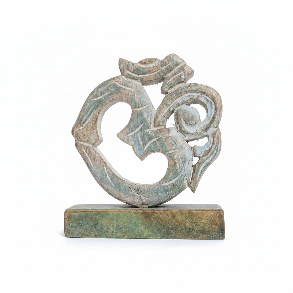 Decorative AUM symbol sculpture on a white background