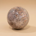 Marble-like sphere on a beige background