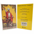 Rider Waite Tarot card deck with yellow cover and tarot card showing a figure in red robe.