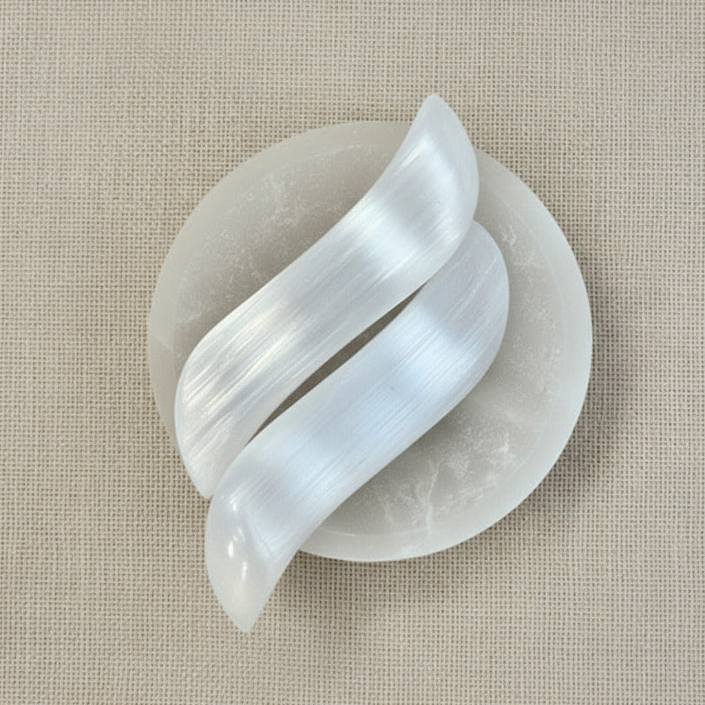polishe selenite massager on a beige fabric background