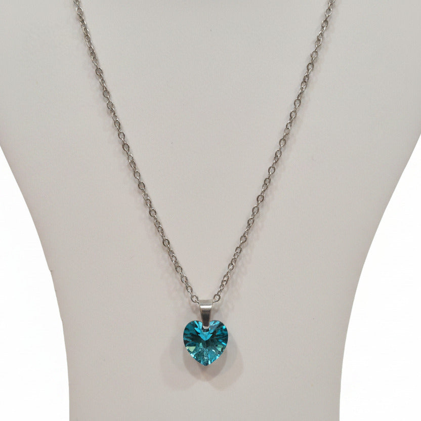 Necklace with a blue heart-shaped pendant on a white background