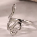 Silver snake-shaped ring on a light gray background