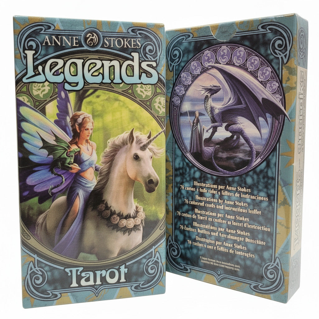 Two tarot card boxes with dragons and unicorns on a gray surface