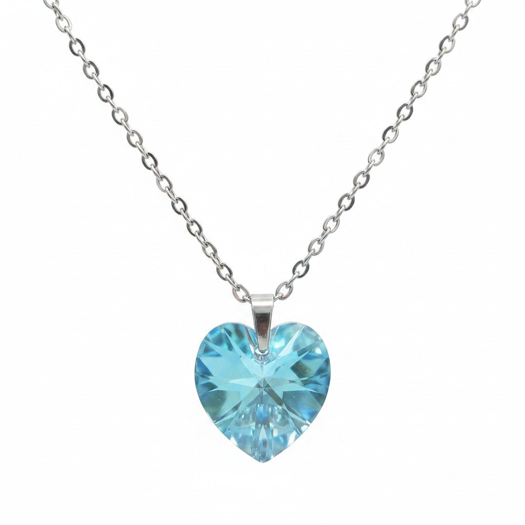 Blue heart-shaped pendant on a chain against a white background