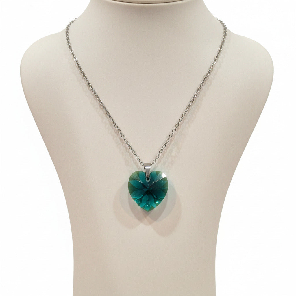 Necklace with a green pendant on a white background