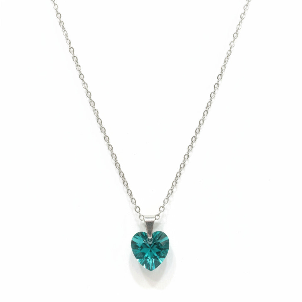 Necklace with a green pendant on a white card