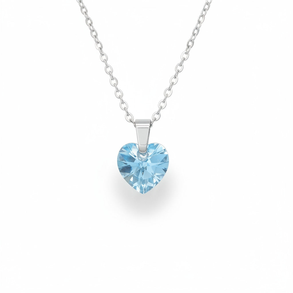 Necklace with a heart-shaped blue gemstone pendant on a white background