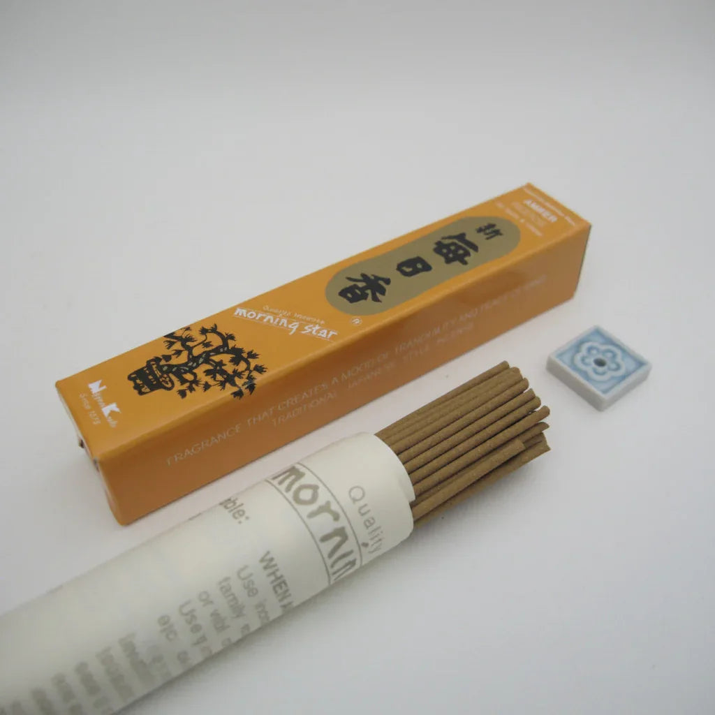 Incense sticks with packaging labeled 'morning star' on a white background