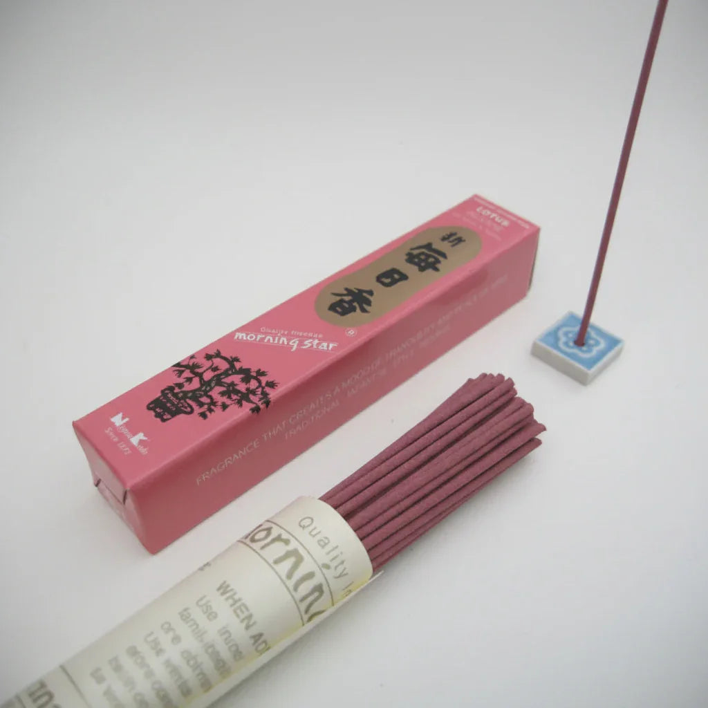 Incense sticks with pink packaging on a white background
