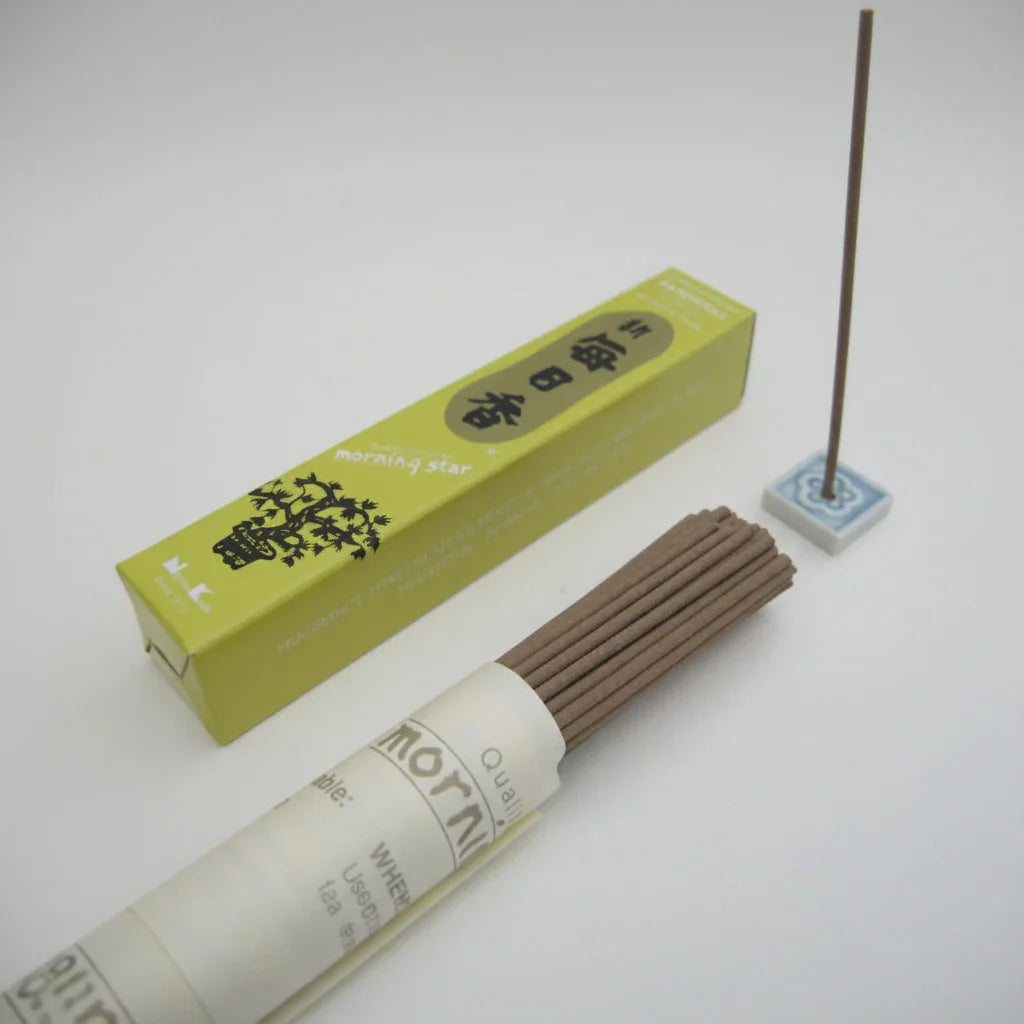 Incense sticks with a green box on a white background