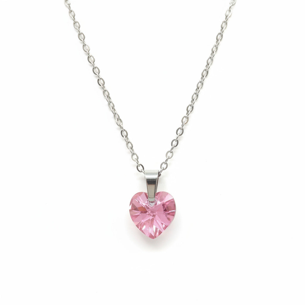 Necklace with a pink heart-shaped pendant on a whitebackground