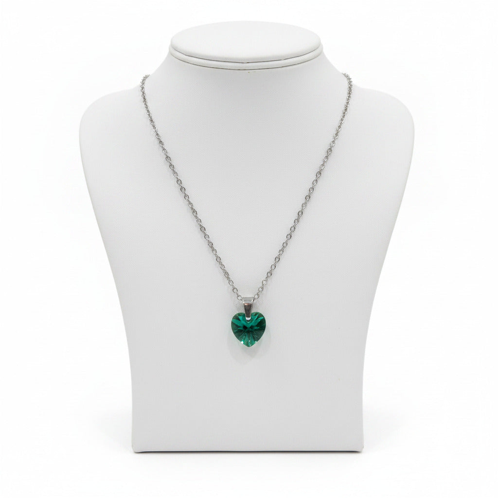 Necklace with a green heart-shaped pendant on a white background